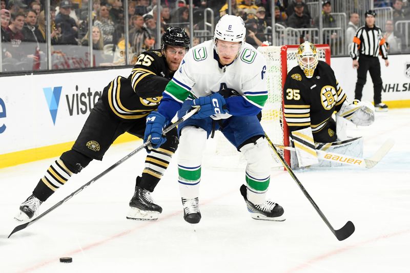 Feb 8, 2024; Boston, Massachusetts, USA; Vancouver Canucks right wing Brock Boeser (6) controls the puck from Boston Bruins defenseman Brandon Carlo (25) during the second period at TD Garden. Mandatory Credit: Bob DeChiara-USA TODAY Sports