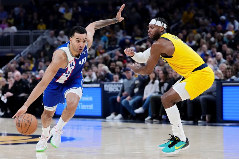 INDIANAPOLIS, INDIANA - FEBRUARY 02: Trey Lyles #41 of the Sacramento Kings dribbles the ball while being guarded by Buddy Hield #7 of the Indiana Pacers in the second quarter at Gainbridge Fieldhouse on February 02, 2024 in Indianapolis, Indiana. NOTE TO USER: User expressly acknowledges and agrees that, by downloading and or using this photograph, User is consenting to the terms and conditions of the Getty Images License Agreement. (Photo by Dylan Buell/Getty Images)