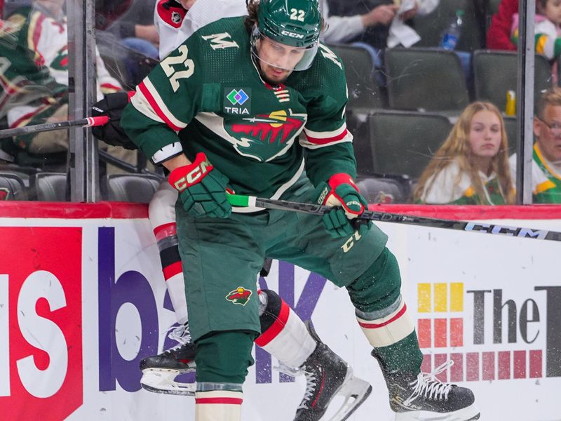 Apr 2, 2024; Saint Paul, Minnesota, USA; Minnesota Wild center Marat Khusnutdinov (22) checks Ottawa Senators defenseman Jacob Bernard-Docker (24) in the second period at Xcel Energy Center. Mandatory Credit: Brad Rempel-USA TODAY Sports