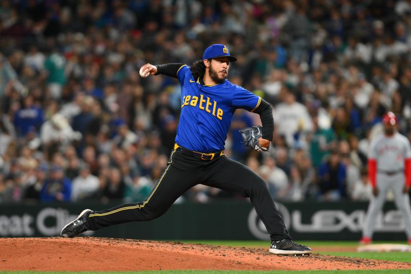 May 31, 2024; Seattle, Washington, USA; Seattle Mariners relief pitcher Andres Munoz (75) pitches to the Los Angeles Angels during the ninth inning at T-Mobile Park. Mandatory Credit: Steven Bisig-USA TODAY Sports