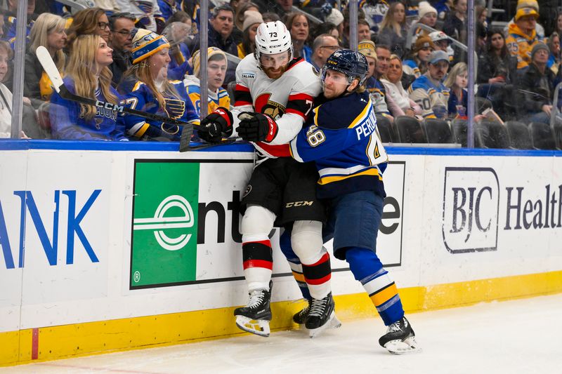 Jan 3, 2025; St. Louis, Missouri, USA;  St. Louis Blues defenseman Scott Perunovich (48) defends against Ottawa Senators left wing Noah Gregor (73) during the first period at Enterprise Center. Mandatory Credit: Jeff Curry-Imagn Images