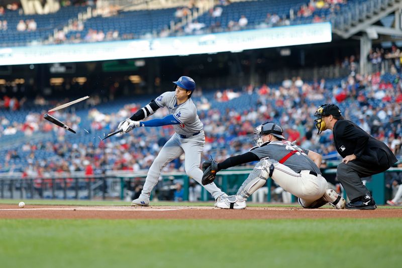 Apr 23, 2024; Washington, District of Columbia, USA; Los Angeles Dodgers designated hitter Shohei Ohtani (17) shatters his bat while hitting a ground ball against the Washington Nationals during the first inning at Nationals Park. Mandatory Credit: Geoff Burke-USA TODAY Sports