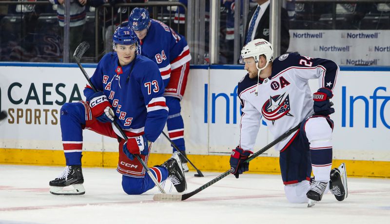 Jan 18, 2025; New York, New York, USA; New York Rangers center Matt Rempe (73) speaks with Columbus Blue Jackets center Mathieu Olivier (24) during warm-ups before the first period at Madison Square Garden. Mandatory Credit: Danny Wild-Imagn Images