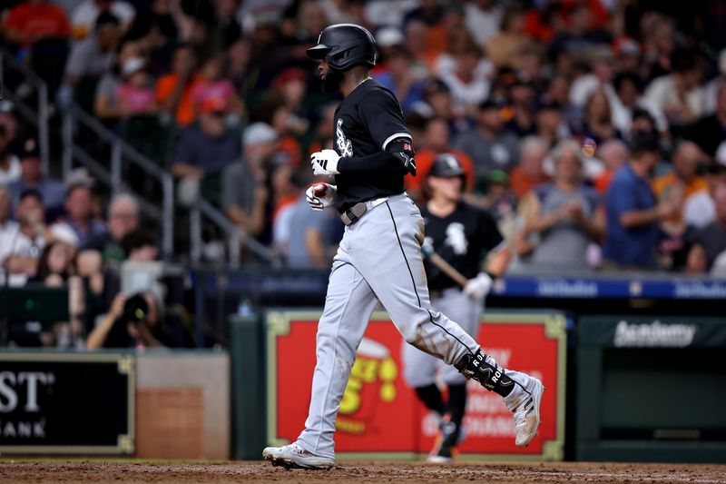 Aug 16, 2024; Houston, Texas, USA; Chicago White Sox center fielder Luis Robert Jr. (88) crosses home plate after hitting a home run to left field against the Houston Astros during the fifth inning at Minute Maid Park. Mandatory Credit: Erik Williams-USA TODAY Sports