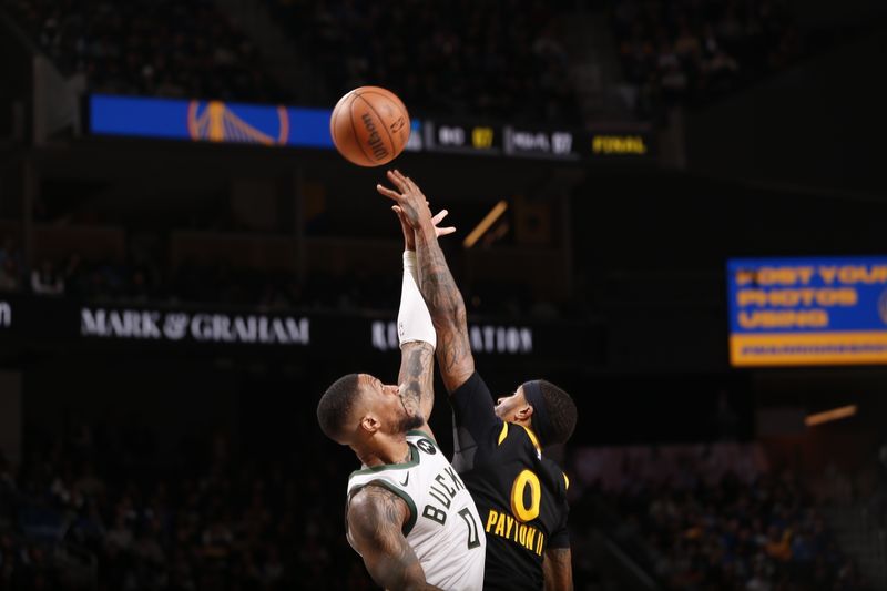 SAN FRANCISCO, CA - MARCH 6: Jumpball between Damian Lillard #0 of the Milwaukee Bucks & Gary Payton II #0 of the Golden State Warriors on March 6, 2024 at Chase Center in San Francisco, California. NOTE TO USER: User expressly acknowledges and agrees that, by downloading and or using this photograph, user is consenting to the terms and conditions of Getty Images License Agreement. Mandatory Copyright Notice: Copyright 2024 NBAE (Photo by Jed Jacobsohn/NBAE via Getty Images)