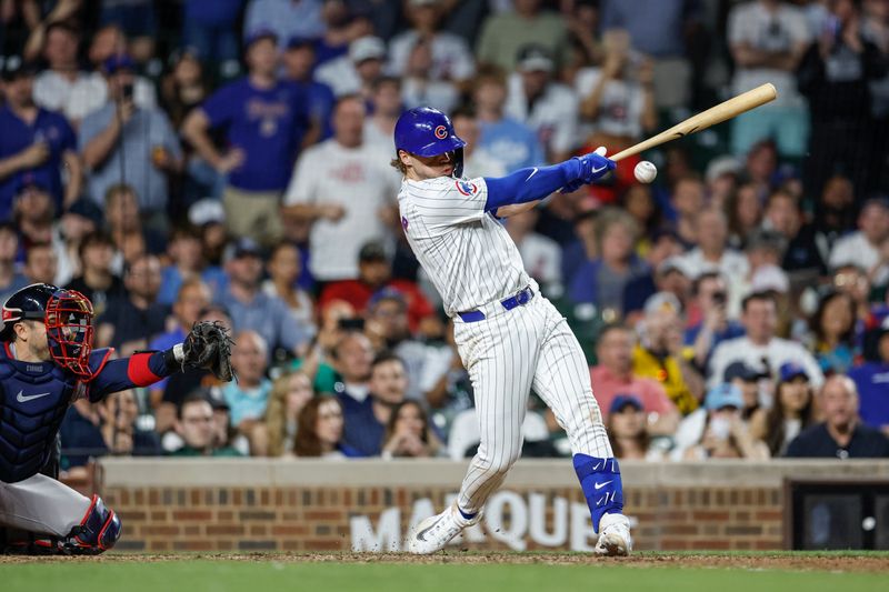 May 21, 2024; Chicago, Illinois, USA; Chicago Cubs second baseman Nico Hoerner (2) hits a game winning walk-off single against the Atlanta Braves during the 10th inning at Wrigley Field. Mandatory Credit: Kamil Krzaczynski-USA TODAY Sports