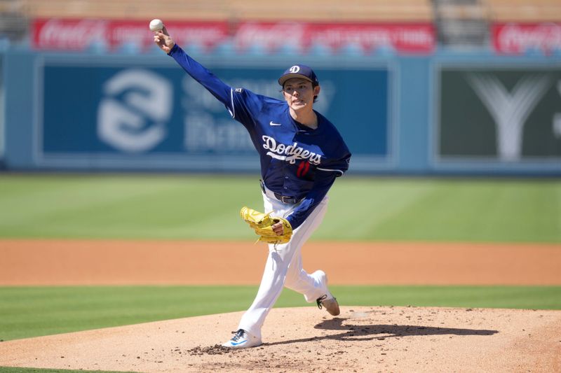 Aug 8, 2025; Los Angeles, California, USA; Los Angeles Dodgers pitcher Roki Sasaki (11) throws before the game against the Toronto Blue Jays at Dodger Stadium. Mandatory Credit: Kirby Lee-Imagn Images