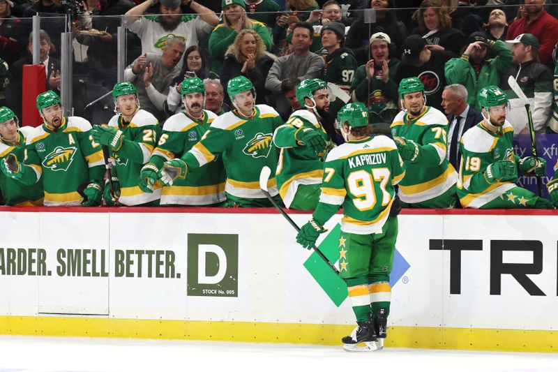 Jan 4, 2023; Saint Paul, Minnesota, USA; Minnesota Wild left wing Kirill Kaprizov (97) celebrates his goal with teammates during the second period against the Tampa Bay Lightning at Xcel Energy Center. Mandatory Credit: Bruce Fedyck-USA TODAY Sports