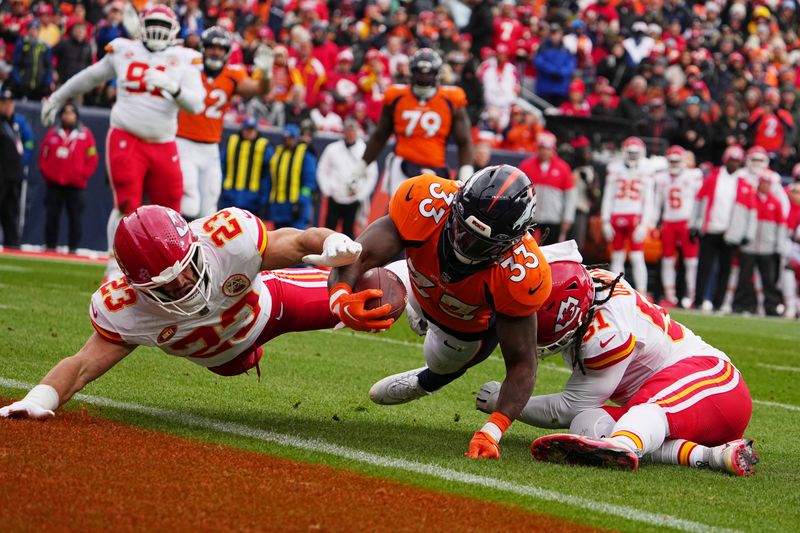 Denver Broncos running back Javonte Williams (33) scores a touchdown against the Kansas City Chiefs of an NFL football game Sunday October 29, 2023, in Denver. (AP Photo/Bart Young)