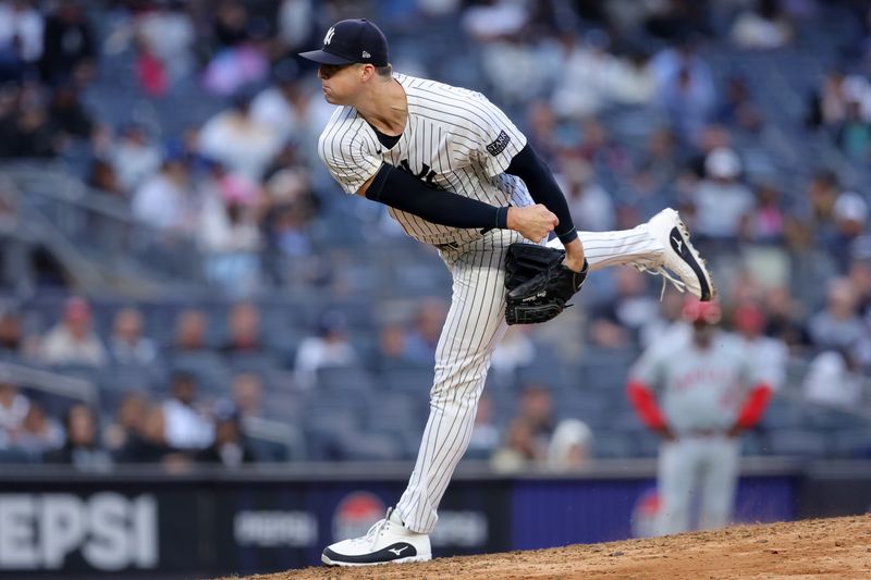 Aug 7, 2024; Bronx, New York, USA; New York Yankees relief pitcher Clay Holmes (35) follows through on a pitch against the Los Angeles Angels during the ninth inning at Yankee Stadium. Mandatory Credit: Brad Penner-USA TODAY Sports