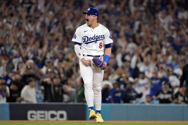 Oct 11, 2024; Los Angeles, California, USA; Los Angeles Dodgers third baseman Enrique Hernandez (8) celebrates after defeating the San Diego Padres during game five of the NLDS for the 2024 MLB Playoffs at Dodger Stadium. Mandatory Credit: Jayne Kamin-Oncea-Imagn Images