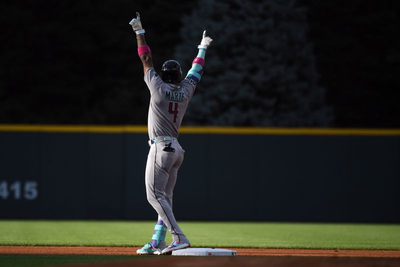 Aug 16, 2025; Denver, Colorado, USA; Arizona Diamondbacks second base Ketel Marte (4) celebrates after a leadoff double during the first inning against the Colorado Rockies at Coors Field. Mandatory Credit: Christopher Hanewinckel-Imagn Images