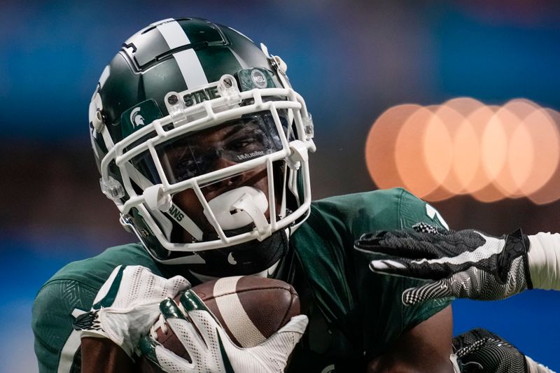 Dec 30, 2021; Atlanta, GA, USA; Michigan State Spartans wide receiver Jayden Reed (1) catches a touchdown pass against the Pittsburgh Panthers during the first quarter during the 2021 Peach Bowl at Mercedes-Benz Stadium. Mandatory Credit: Dale Zanine-USA TODAY Sports