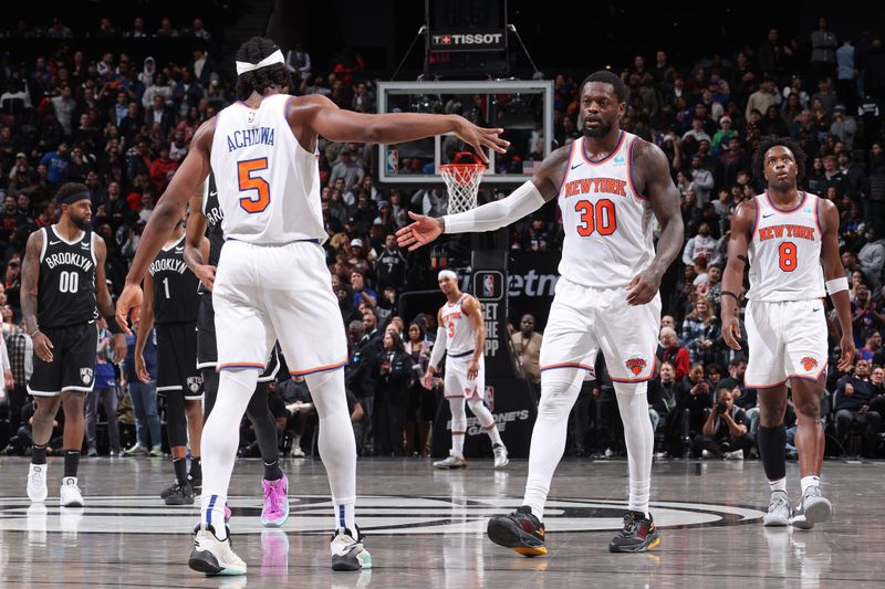 BROOKLYN, NY - JANUARY 23: Precious Achiuwa #5 and Julius Randle #30 of the New York Knicks high five after the game against the Brooklyn Nets on January 23, 2024 at Barclays Center in Brooklyn, New York. NOTE TO USER: User expressly acknowledges and agrees that, by downloading and or using this Photograph, user is consenting to the terms and conditions of the Getty Images License Agreement. Mandatory Copyright Notice: Copyright 2024 NBAE (Photo by Nathaniel S. Butler/NBAE via Getty Images)