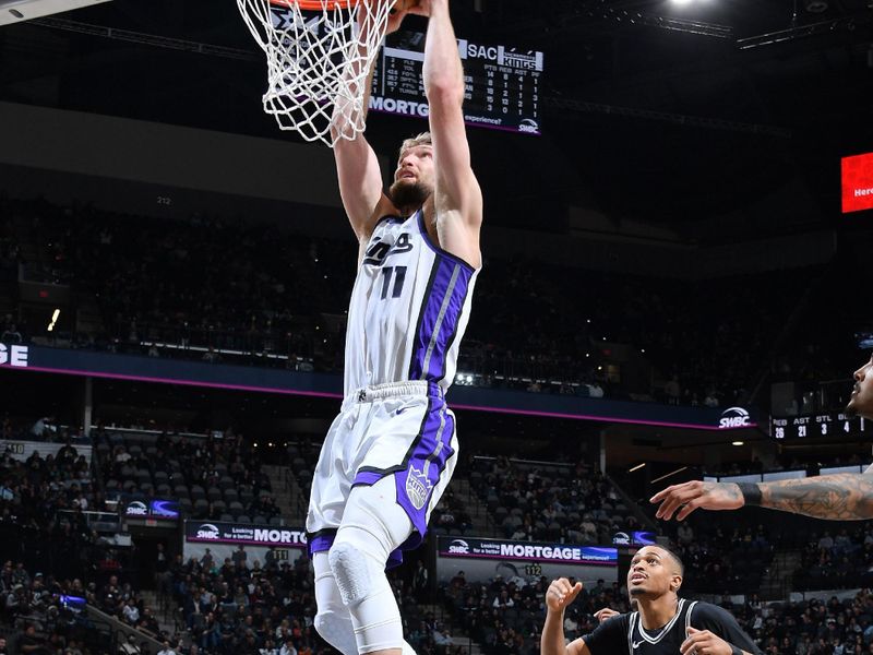 SAN ANTONIO, TX - DECEMBER 6: Domantas Sabonis #11 of the Sacramento Kings dunks the ball during the game against the San Antonio Spurs on December 6, 2024 at the Frost Bank Center in San Antonio, Texas. NOTE TO USER: User expressly acknowledges and agrees that, by downloading and or using this photograph, user is consenting to the terms and conditions of the Getty Images License Agreement. Mandatory Copyright Notice: Copyright 2024 NBAE (Photos by Michael Gonzales/NBAE via Getty Images)