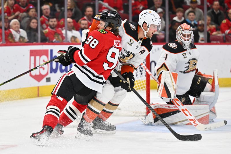 Dec 7, 2023; Chicago, Illinois, USA; Chicago Blackhawks forward Connor Bedard (98) gets jammed up at the net by Anaheim Ducks defenseman Cam Fowler (4) in the third period at United Center. Mandatory Credit: Jamie Sabau-USA TODAY Sports