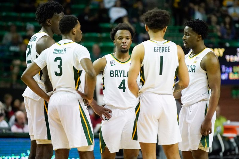 Mar 4, 2023; Waco, Texas, USA; Baylor Bears guard LJ Cryer (4) and teammates huddle on the court after a timeout against the Iowa State Cyclones during the second half at Ferrell Center. Mandatory Credit: Raymond Carlin III-USA TODAY Sports