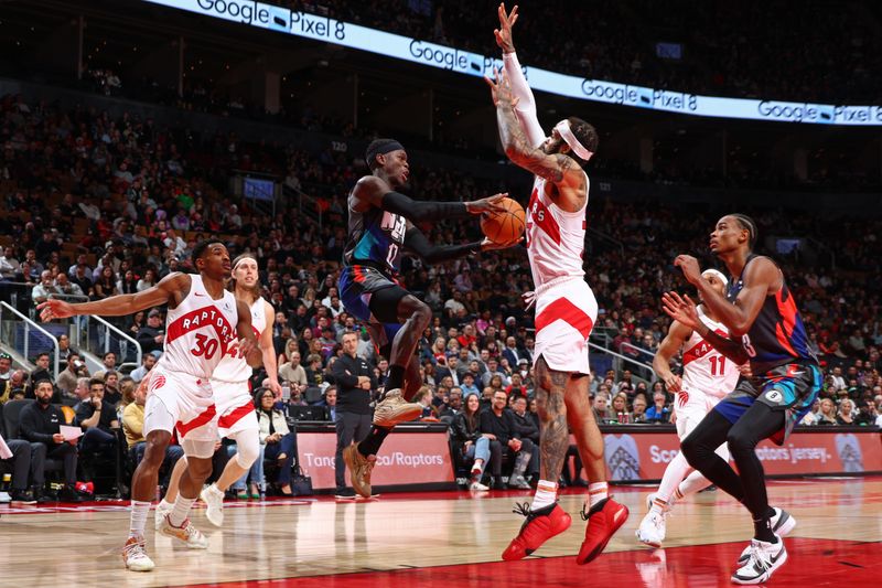 TORONTO, CANADA - MARCH 25: Dennis Schroder #17 of the Brooklyn Nets passes the ball during the game against the Toronto Raptors on March 25, 2024 at the Scotiabank Arena in Toronto, Ontario, Canada.  NOTE TO USER: User expressly acknowledges and agrees that, by downloading and or using this Photograph, user is consenting to the terms and conditions of the Getty Images License Agreement.  Mandatory Copyright Notice: Copyright 2024 NBAE (Photo by Vaughn Ridley/NBAE via Getty Images)