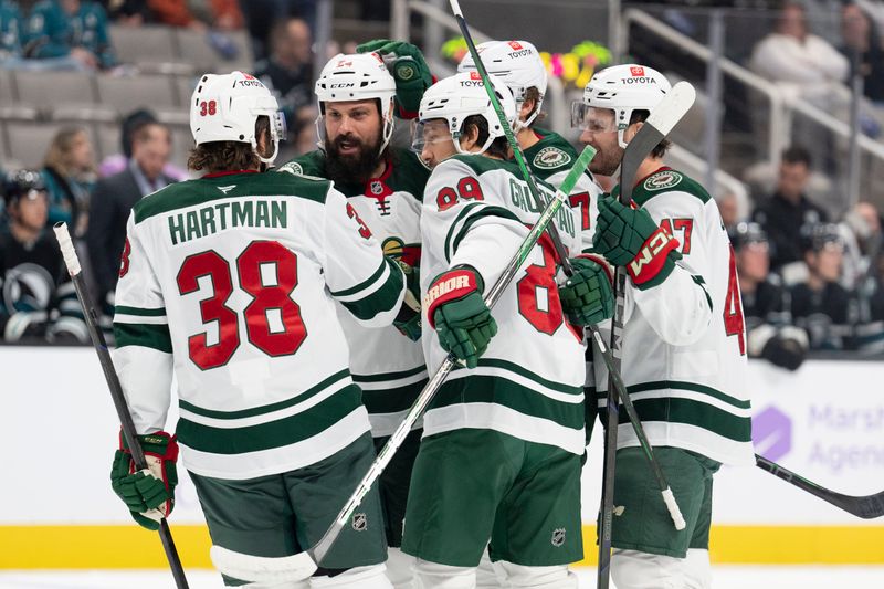 Nov 7, 2024; San Jose, California, USA;  Minnesota Wild right wing Ryan Hartman (38) joins his teammates in celebration during the first period against the San Jose Sharks at SAP Center at San Jose. Mandatory Credit: Stan Szeto-Imagn Images