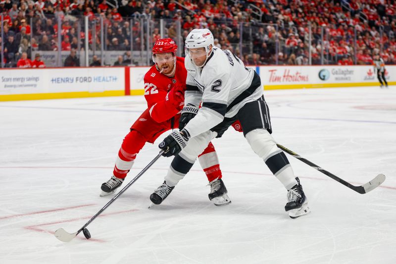 Jan 27, 2026; Detroit, Michigan, USA; Los Angeles Kings defenseman Brian Dumoulin (2) handles the puck against Detroit Red Wings center Mason Appleton (22) during the second period at Little Caesars Arena. Mandatory Credit: Brian Bradshaw Sevald-Imagn Images