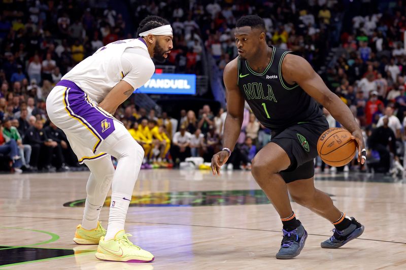 NEW ORLEANS, LOUISIANA - APRIL 14: Zion Williamson #1 of the New Orleans Pelicans is defended by Anthony Davis #3 of the Los Angeles Lakers during a game at Smoothie King Center on April 14, 2024 in New Orleans, Louisiana.  NOTE TO USER: User expressly acknowledges and agrees that, by downloading and or using this photograph, User is consenting to the terms and conditions of the Getty Images License Agreement. (Photo by Tyler  Kaufman/Getty Images)