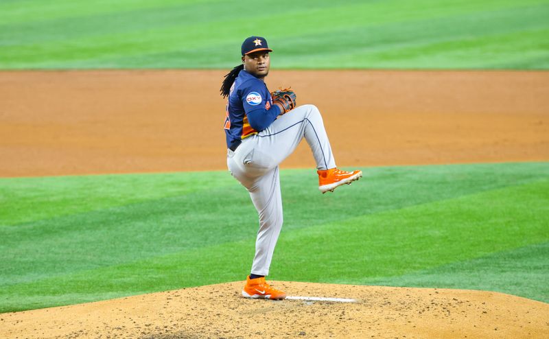 Aug 6, 2024; Arlington, Texas, USA;  Houston Astros starting pitcher Framber Valdez (59) throws during the fourth inning against the Texas Rangers at Globe Life Field. Mandatory Credit: Kevin Jairaj-USA TODAY Sports