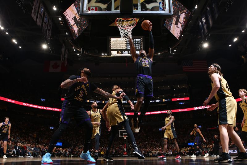 TORONTO, CANADA - APRIL 2: Rui Hachimura #28 of the Los Angeles Lakers drives to the basket during the game against the Toronto Raptors on April 2, 2024 at the Scotiabank Arena in Toronto, Ontario, Canada.  NOTE TO USER: User expressly acknowledges and agrees that, by downloading and or using this Photograph, user is consenting to the terms and conditions of the Getty Images License Agreement.  Mandatory Copyright Notice: Copyright 2023 NBAE (Photo by Vaughn Ridley/NBAE via Getty Images)