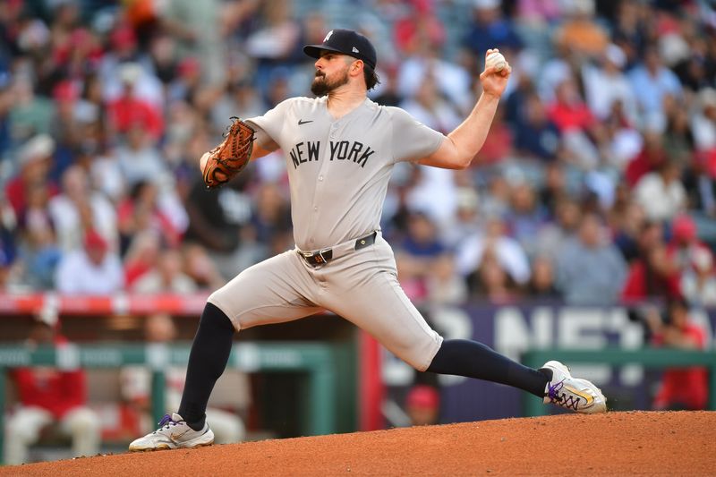 May 27, 2025; Anaheim, California, USA; New York Yankees pitcher Carlos Rodón (55) throws against the Los Angeles Angels during the first inning at Angel Stadium. Mandatory Credit: Gary A. Vasquez-Imagn Images