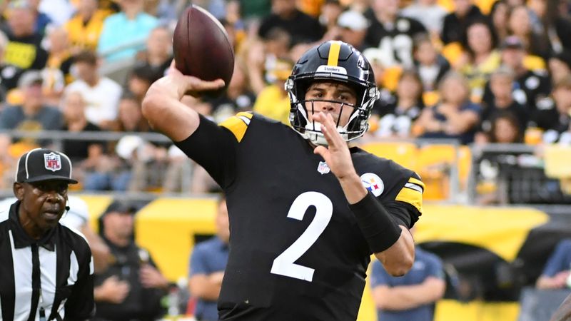 Pittsburgh Steelers quarterback Mason Rudolph (2) throws a touchdown pass as Seattle Seahawks defensive tackle Quinton Jefferson (77) pressures during the first half of an NFL preseason football game, Saturday, Aug. 13, 2022, in Pittsburgh. (AP Photo/Fred Vuich)