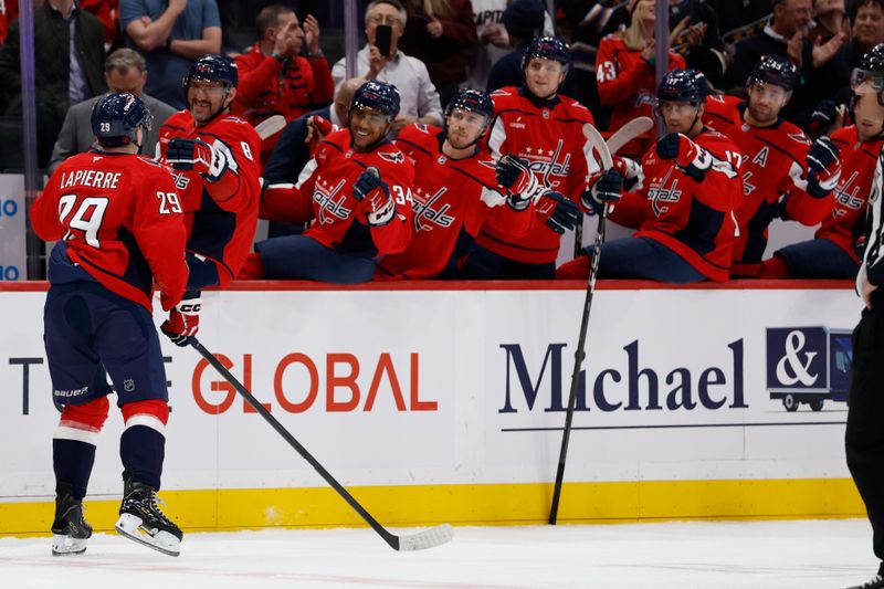 Mar 9, 2026; Washington, District of Columbia, USA; Washington Capitals center Hendrix Lapierre (29) celebrates with teammates after scoring a goal against the Calgary Flames during the first period at Capital One Arena. Mandatory Credit: Geoff Burke-Imagn Images