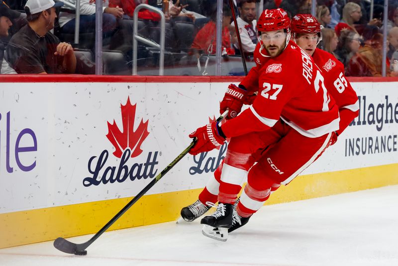 Oct 15, 2025; Detroit, Michigan, USA;  Detroit Red Wings center Michael Rasmussen (27) skates with the puck in the first period against the Florida Panthers at Little Caesars Arena. Mandatory Credit: Rick Osentoski-Imagn Images