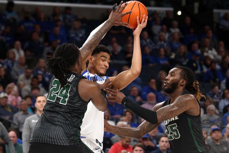 Feb 11, 2024; Memphis, Tennessee, USA; Memphis Tigers forward Nicholas Jourdain (2) handles the ball as Tulane Green Wave forward Kevin Cross (24) and guard Jaylen Forbes (25) defends during the first half at FedExForum. Mandatory Credit: Petre Thomas-USA TODAY Sports