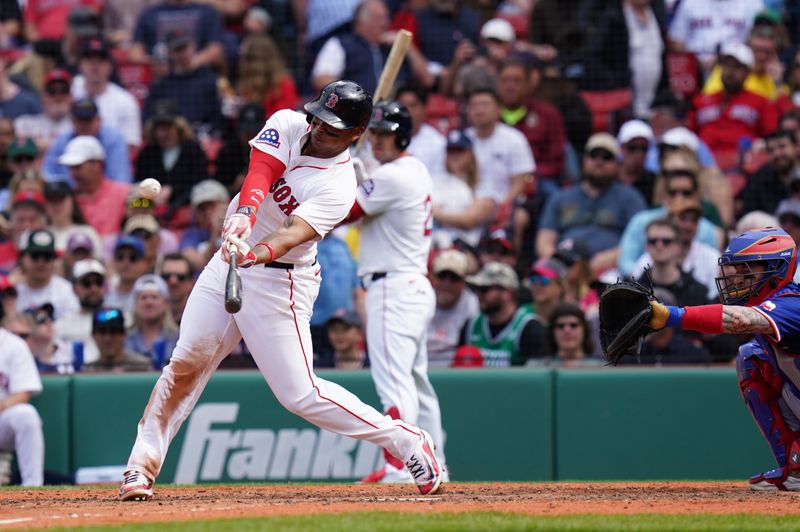 May 8, 2025; Boston, Massachusetts, USA; Boston Red Sox designated hitter Rafael Devers (11) hits a home run against the Texas Rangers in the seventh inning at Fenway Park. Mandatory Credit: David Butler II-Imagn Images