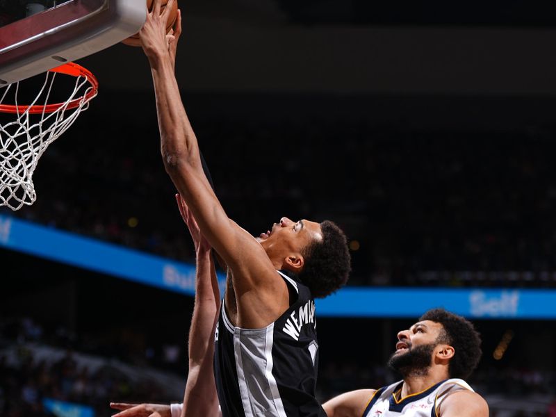 SAN ANTONIO, TX - APRIL 12: Victor Wembanyama #1 of the San Antonio Spurs drives to the basket during the game against the Denver Nuggets on April 12, 2024 at the Frost Bank Center in San Antonio, Texas. NOTE TO USER: User expressly acknowledges and agrees that, by downloading and or using this photograph, user is consenting to the terms and conditions of the Getty Images License Agreement. Mandatory Copyright Notice: Copyright 2024 NBAE (Photos by Garrett Ellwood/NBAE via Getty Images)