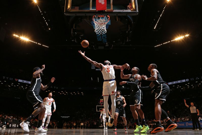 BROOKLYN, NY - JANUARY 23: Precious Achiuwa #5 of the New York Knicks rebounds during the game against the Brooklyn Nets on January 23, 2024 at Barclays Center in Brooklyn, New York. NOTE TO USER: User expressly acknowledges and agrees that, by downloading and or using this Photograph, user is consenting to the terms and conditions of the Getty Images License Agreement. Mandatory Copyright Notice: Copyright 2024 NBAE (Photo by Nathaniel S. Butler/NBAE via Getty Images)