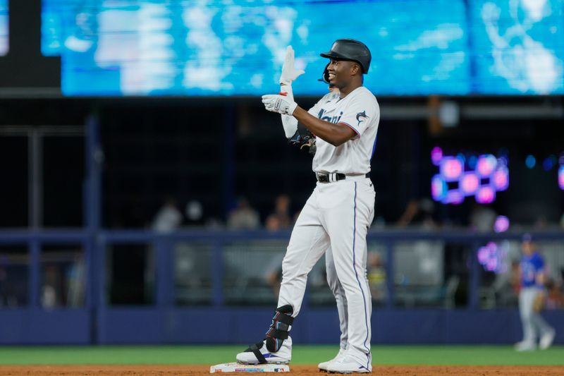 Jun 19, 2023; Miami, Florida, USA; Miami Marlins right fielder Jesus Sanchez (7) reacts from second base after hitting a double against the Toronto Blue Jays during the third inning at loanDepot Park. Mandatory Credit: Sam Navarro-USA TODAY Sports