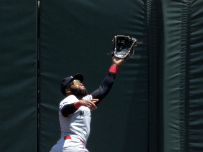 Jul 14, 2024; San Francisco, California, USA; Minnesota Twins center fielder Manuel Margot (13) makes a leaping catch of a deep fly ball off the bat of San Francisco Giants catcher Patrick Bailey during the second inning at Oracle Park. Mandatory Credit: D. Ross Cameron-USA TODAY Sports