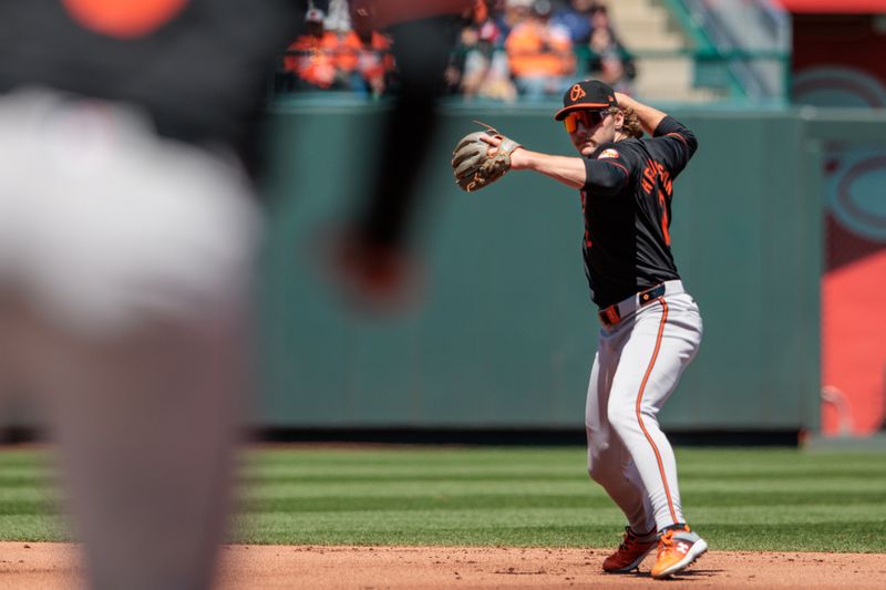 Apr 21, 2024; Kansas City, Missouri, USA; Baltimore Orioles shortstop Gunnar Henderson (2) throws to first base during the first inning against the Kansas City Royals at Kauffman Stadium. Mandatory Credit: William Purnell-USA TODAY Sports
