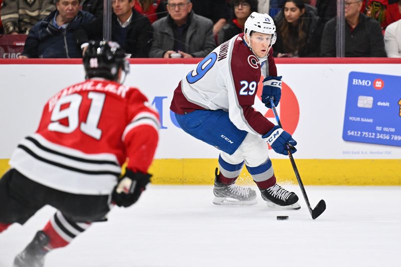 Dec 19, 2023; Chicago, Illinois, USA; Colorado Avalanche forward Nathan MacKinnon (29) controls the puck in the second period against the Chicago Blackhawks at United Center. Mandatory Credit: Jamie Sabau-USA TODAY Sports