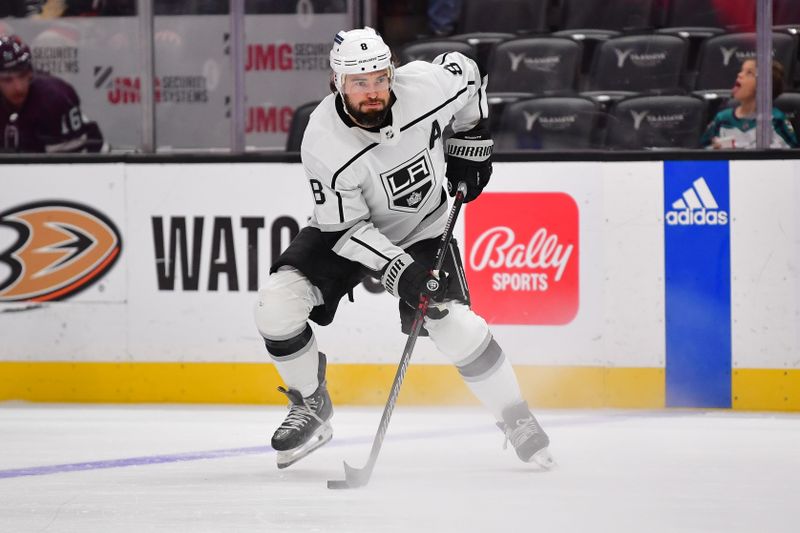 Nov 24, 2023; Anaheim, California, USA; Los Angeles Kings defenseman Drew Doughty (8) controls the puck against the Anaheim Ducks during the first period at Honda Center. Mandatory Credit: Gary A. Vasquez-USA TODAY Sports