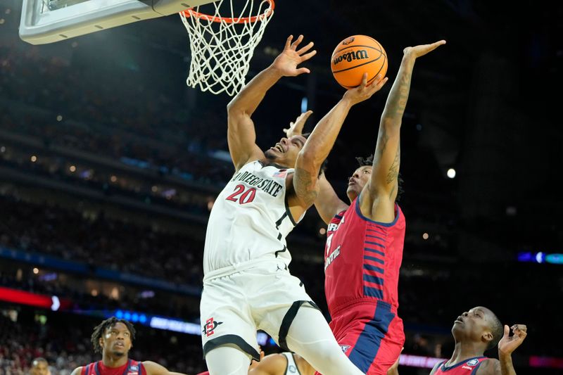 Apr 1, 2023; Houston, TX, USA; San Diego State Aztecs guard Matt Bradley (20) shoots the ball against Florida Atlantic Owls forward Giancarlo Rosado (3) during the second half in the semifinals of the Final Four of the 2023 NCAA Tournament at NRG Stadium. Mandatory Credit: Bob Donnan-USA TODAY Sports