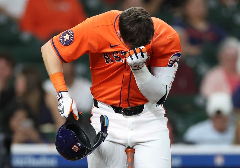 May 13, 2025; Houston, Texas, USA; Houston Astros left fielder Chas McCormick (20) wipes his brow during his at bat against the Kansas City Royals in the third inning at Daikin Park. McCormick was walked on the at bat. Mandatory Credit: Thomas Shea-Imagn Images