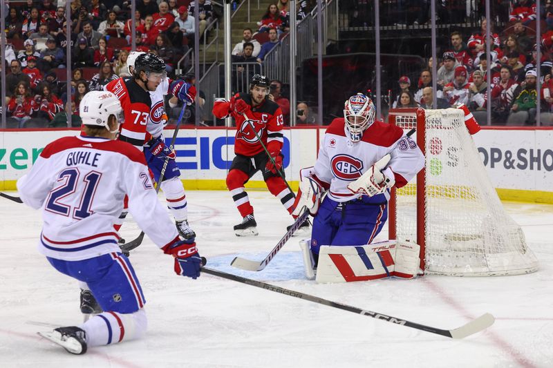 Jan 17, 2024; Newark, New Jersey, USA; Montreal Canadiens goaltender Sam Montembeault (35) makes a save against the New Jersey Devils during the second period at Prudential Center. Mandatory Credit: Ed Mulholland-USA TODAY Sports