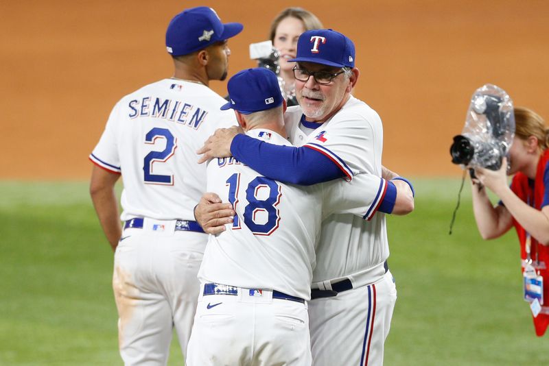 Oct 10, 2023; Arlington, Texas, USA; Texas Rangers catcher Mitch Garver (18) and manager Bruce Bochy celebrate after defeating the Baltimore Orioles in game three of the ALDS for the 2023 MLB playoffs at Globe Life Field. Mandatory Credit: Andrew Dieb-USA TODAY Sports