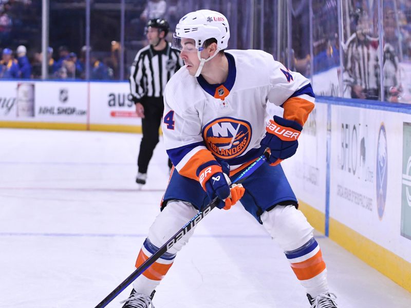 Oct 21, 2023; Buffalo, New York, USA; New York Islanders defenseman Samuel Bolduc (4) handles the puck in the first period against the Buffalo Sabres at KeyBank Center. Mandatory Credit: Mark Konezny-USA TODAY Sports