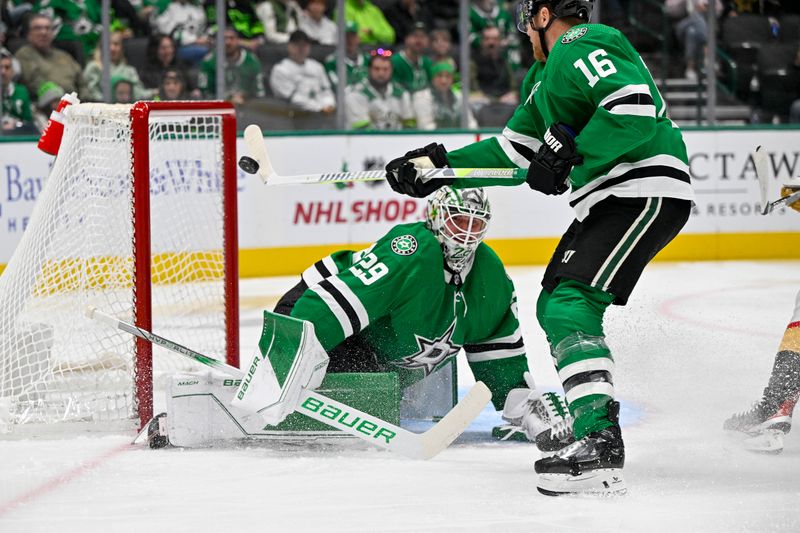 Dec 9, 2023; Dallas, Texas, USA; Dallas Stars center Joe Pavelski (16) knocks the puck away in midair in front of goaltender Jake Oettinger (29) during the first period at the American Airlines Center. Mandatory Credit: Jerome Miron-USA TODAY Sports