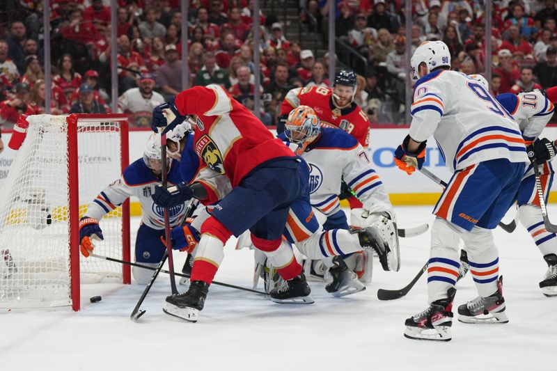Jun 18, 2024; Sunrise, Florida, USA; Florida Panthers forward Evan Rodrigues (17) scores against Edmonton Oilers during the second period in game five of the 2024 Stanley Cup Final at Amerant Bank Arena. Mandatory Credit: Jim Rassol-USA TODAY Sports