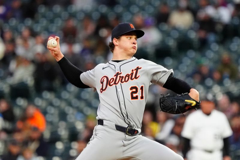 May 7, 2025; Denver, Colorado, USA; Detroit Tigers starting pitcher Jackson Jobe (21) delivers a pitch in the third inning against the Colorado Rockies at Coors Field. Mandatory Credit: Ron Chenoy-Imagn Images