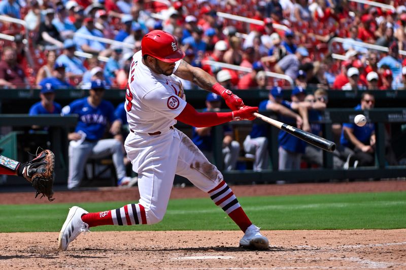 Jul 31, 2024; St. Louis, Missouri, USA;  St. Louis Cardinals right fielder Tommy Pham (29) hits a two run double against the Texas Rangers during the fifth inning at Busch Stadium. Mandatory Credit: Jeff Curry-USA TODAY Sports