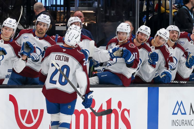 Oct 24, 2024; Salt Lake City, Utah, USA; Colorado Avalanche center Ross Colton (20) celebrates scoring a goal against the Utah Hockey Club with bench players during the first period at Delta Center. Mandatory Credit: Rob Gray-Imagn Images